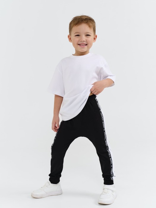 брюки со спущенным шагом и лампасами "уголь" от бренда bungly вид слева