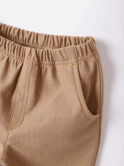 чиносы из джинскота "миндаль" по цене 1999 руб вид справа