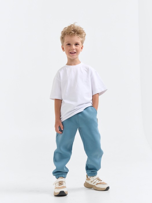 джоггеры "деним" с карманами утепленные от бренда bungly вид слева