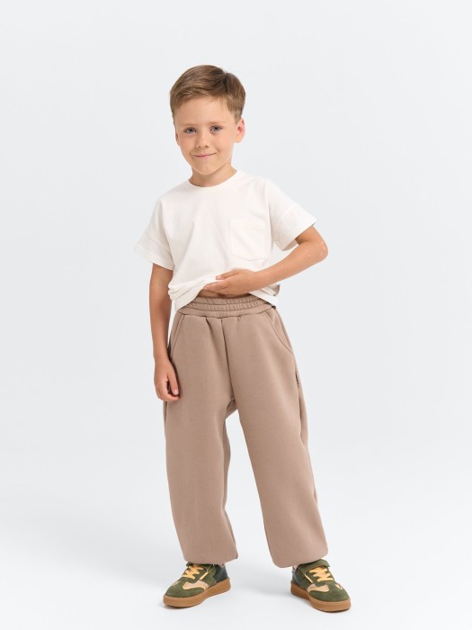 джоггеры оверсайз "кокос" с карманами утепленные от бренда bungly вид слева