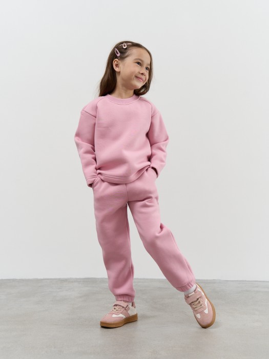 джоггеры "пудра" с карманами утепленные от бренда bungly вид слева