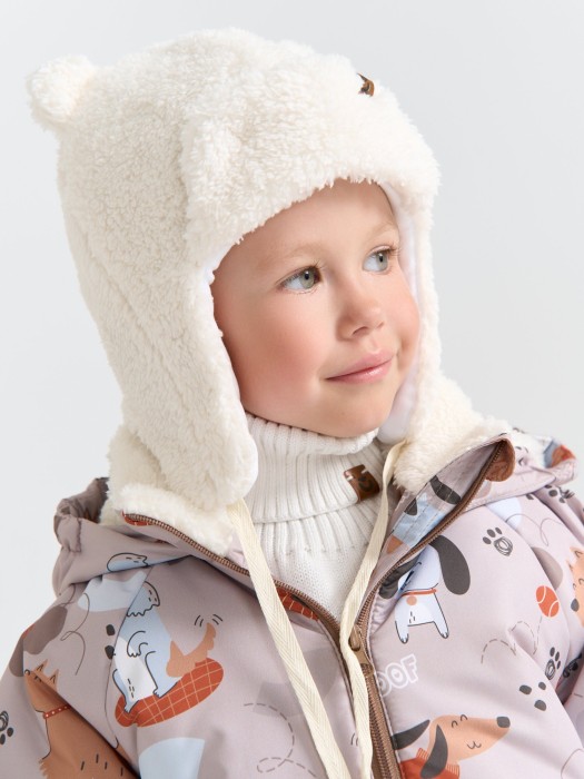 шапка-ушанка меховая "молоко" 0+ от бренда bungly вид слева