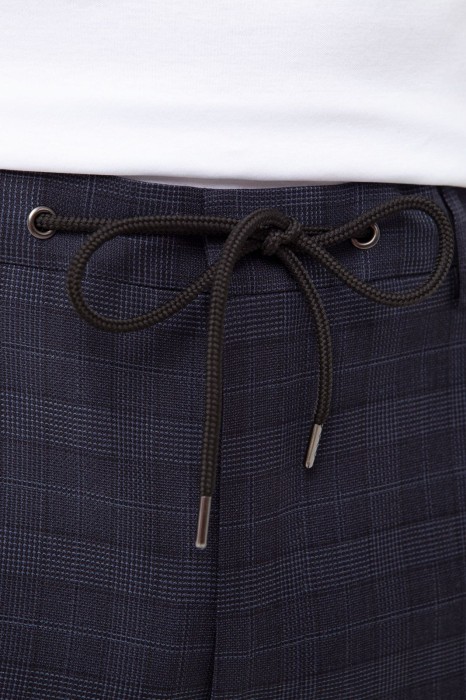 брюки из шерсти в клетку на кулиске с водоотталкивающей обработкой от бренда kanzler вид слева