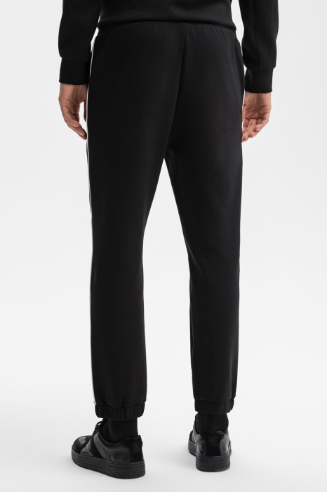 брюки спортивные из хлопка по цене 8990 руб вид справа