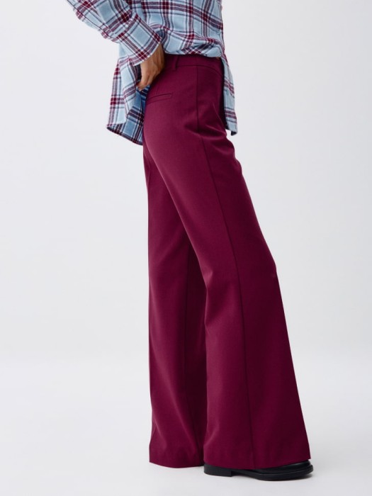 брюки клеш из костюмной ткани из россии вид сбоку