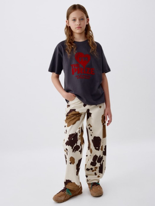 брюки с коровьим принтом для девочек от бренда sela вид слева