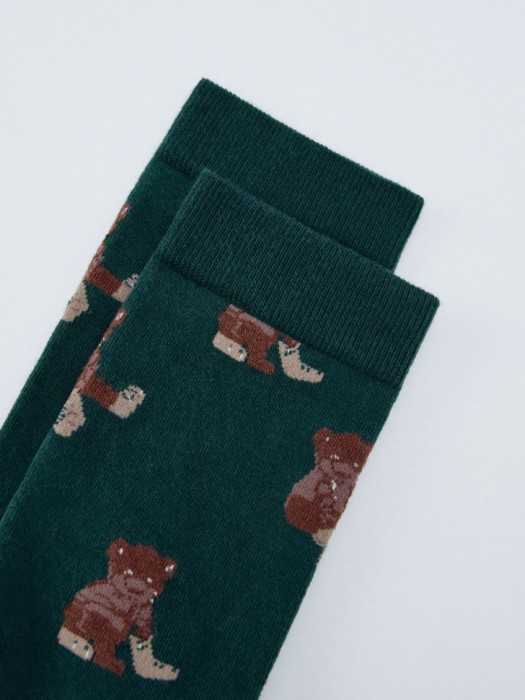 длинные носки новогодние от бренда sela вид слева