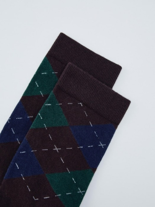 длинные носки новогодние от бренда sela вид слева