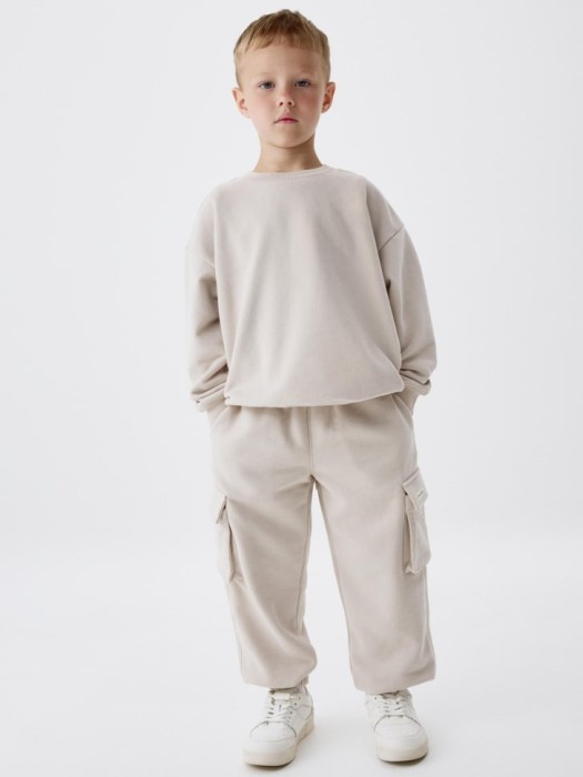 джоггеры карго детские от бренда sela вид слева