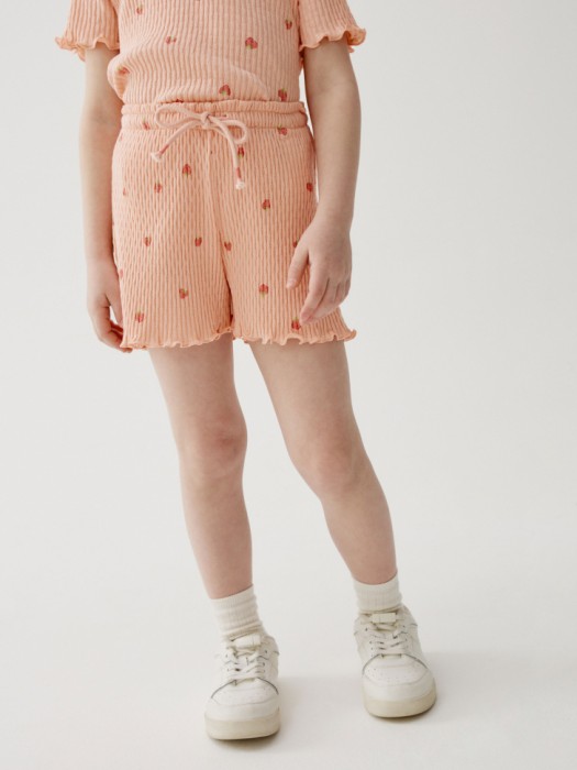 короткие шорты с принтом для девочек от бренда sela вид слева