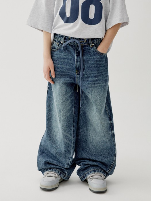 объемные джинсы багги на резинке для мальчиков от бренда sela вид слева