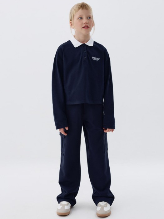 поло оверсайз с длинным рукавом для девочек от бренда sela вид слева