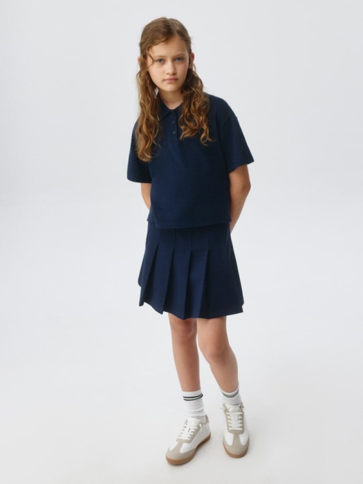 поло оверсайз с короткими рукавами для девочек от бренда sela вид слева