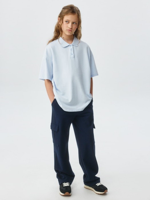 поло оверсайз с короткими рукавами для девочек от бренда sela вид слева
