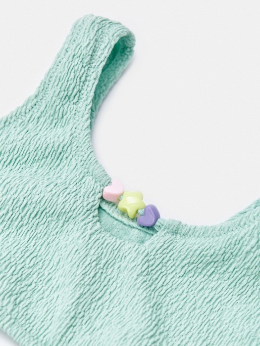 раздельный купальник с декором для девочек от бренда sela вид слева