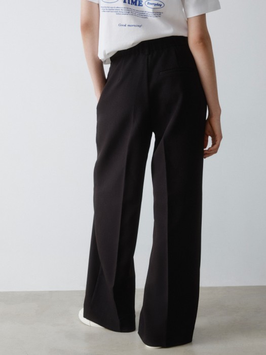 широкие брюки из костюмной ткани из россии вид сбоку