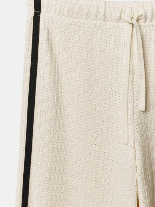 широкие брюки с лампасами для девочек из трикотажа спереди