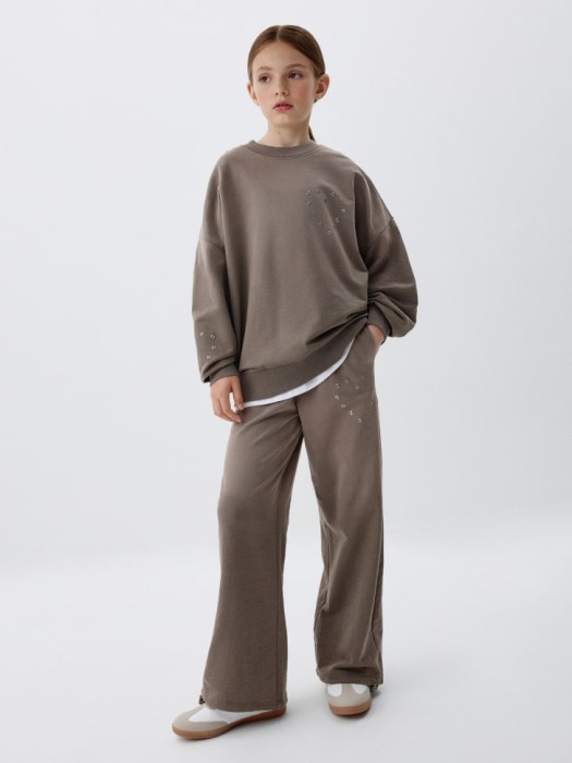 широкие брюки с люверсами для девочек от бренда sela вид слева