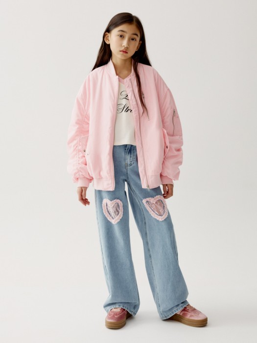 широкие джинсы с вырезами в форме сердца для девочек от бренда sela вид слева