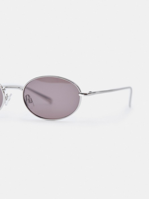 солнцезащитные очки с металлической оправой овальной формы от бренда sela вид слева