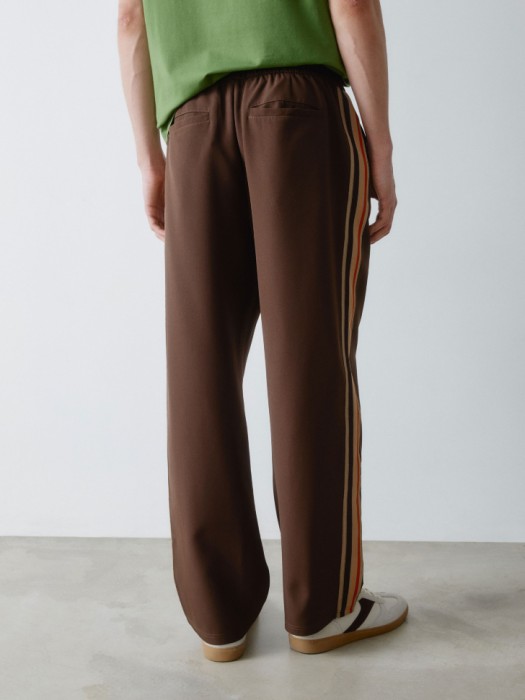 свободные брюки с лампасами из проверенных материалов спереди