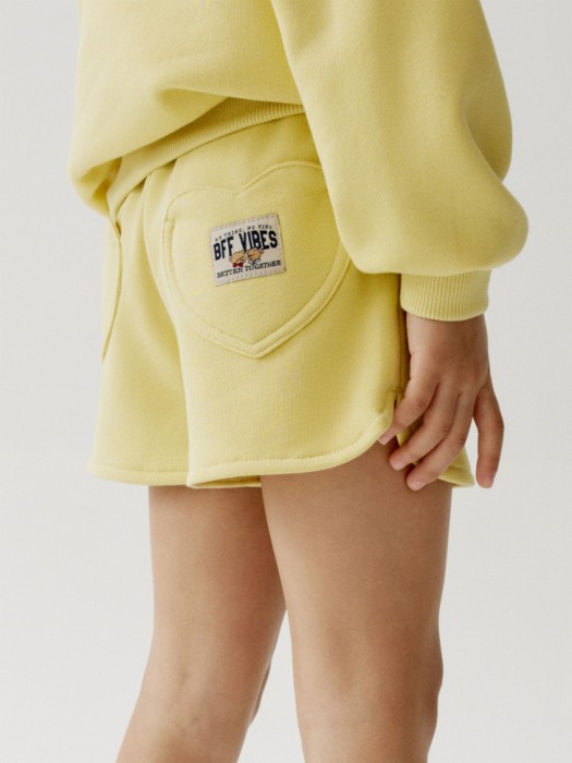 трикотажные шорты фигурными карманами для девочек от бренда sela вид слева