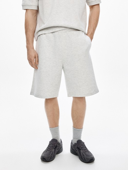 трикотажные удлиненные шорты от бренда sela вид слева