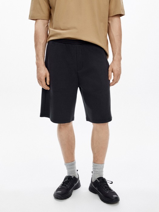 трикотажные удлиненные шорты от бренда sela вид слева