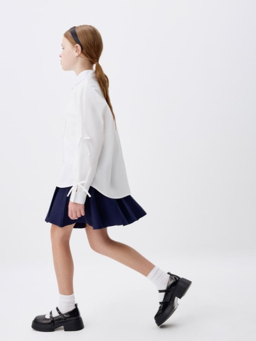 вязаная юбка в складку для девочек из льна спереди