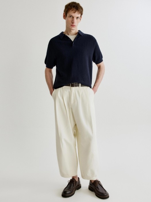 вязаное поло с коротким рукавом от бренда sela вид слева