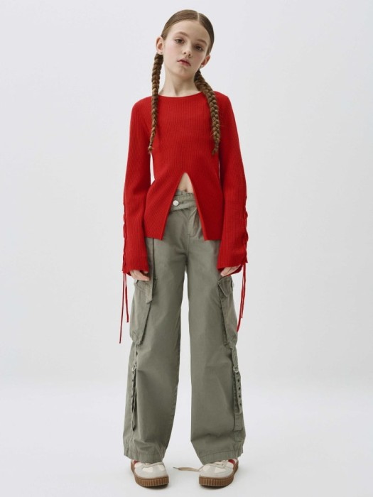 вязаный джемпер со шнуровкой для девочек от бренда sela вид слева