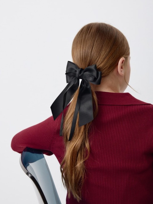 заколка для волос с бантом для девочек от бренда sela вид слева