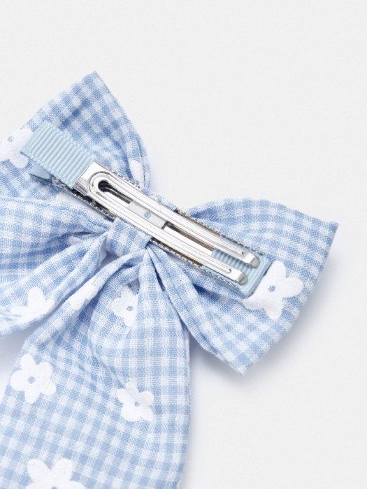 заколка для волос с бантом для девочек от бренда sela вид слева