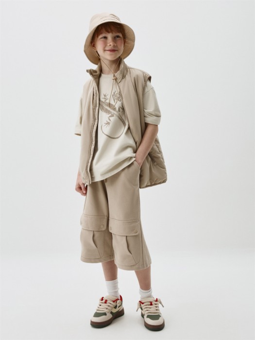 жилет утепленный детский от бренда sela вид слева