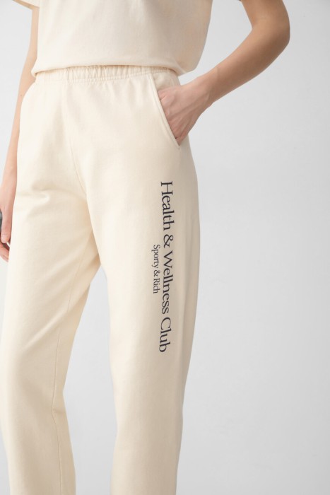 брюки sporty rich модель h&w crest из америки вид сбоку