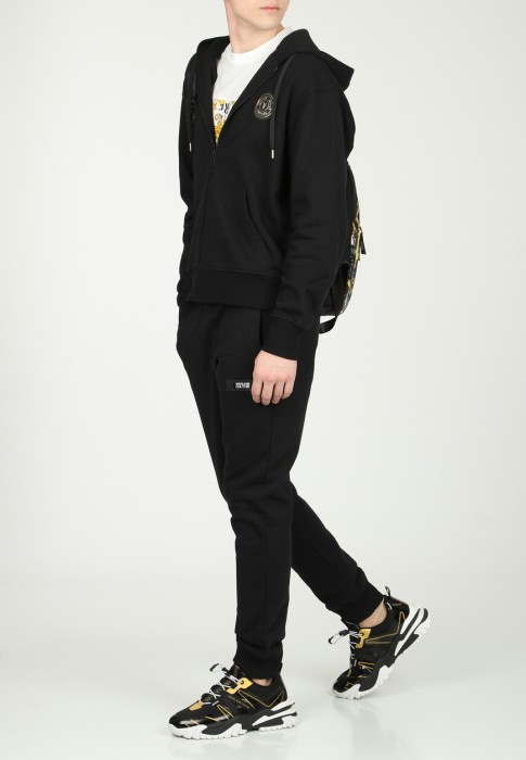 брюки  от бренда versace jeans couture вид слева