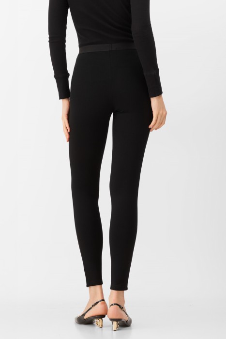 леггинсы  от бренда versace вид слева