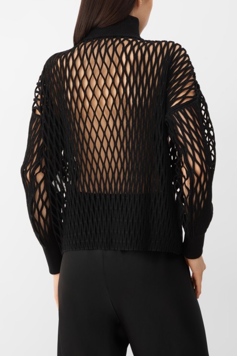 водолазка  модель из эксклюзивной коллекции от бренда alaia вид слева