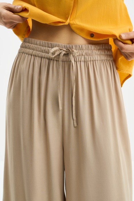 брюки-палаццо из россии вид сбоку