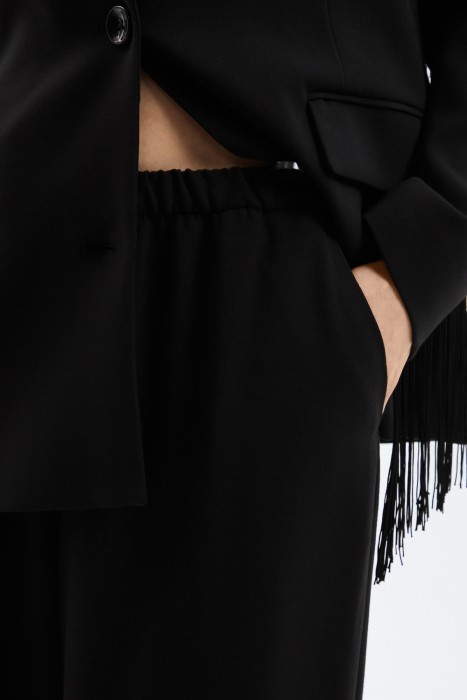 брюки от бренда снежная королева вид слева