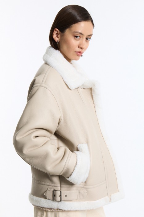 дубленка из искусственного меха от бренда снежная королева вид слева