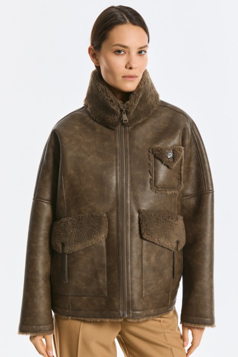 дубленка из искусственной кожи и натуральной шерсти от бренда снежная королева вид слева