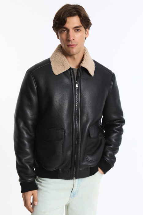 дубленка из искусственной кожи от бренда снежная королева вид слева