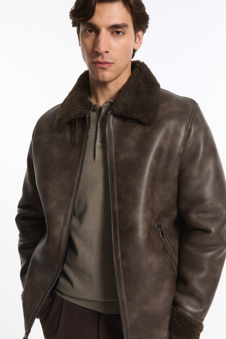 дубленка из искусственной кожи от бренда снежная королева вид слева