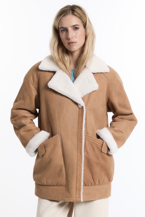 дубленка из овчины от бренда снежная королева вид слева