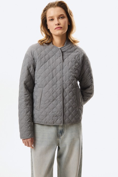 стеганая куртка от бренда снежная королева вид слева