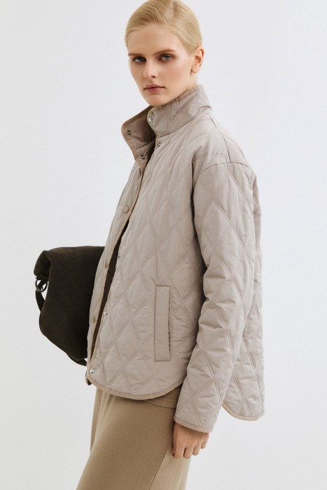 стеганая куртка от бренда снежная королева вид слева