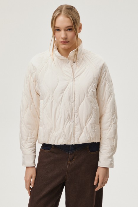 стеганая куртка от бренда снежная королева вид слева