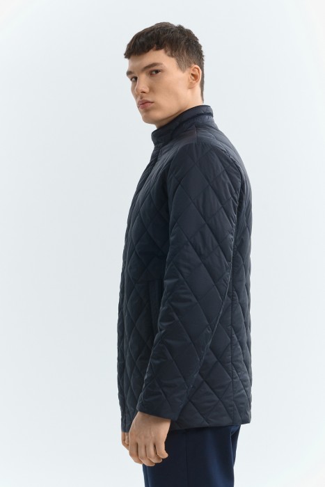 стеганая куртка от бренда снежная королева вид слева