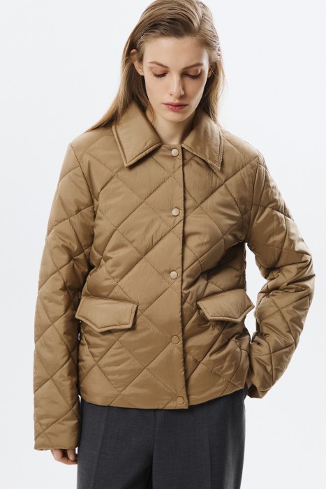 стеганая куртка от бренда снежная королева вид слева